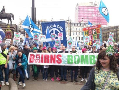 Scottish CND supports behind a banner that reads "Bairns not bombs"
