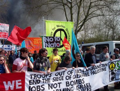 CND banner among marchers at anti-NATO demo