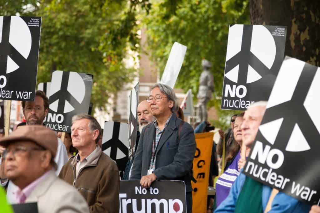 Demonstrators with No nuclear war and No to Trump placards