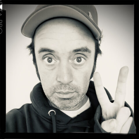 Musician Beans on Toast gives the peace hand sign